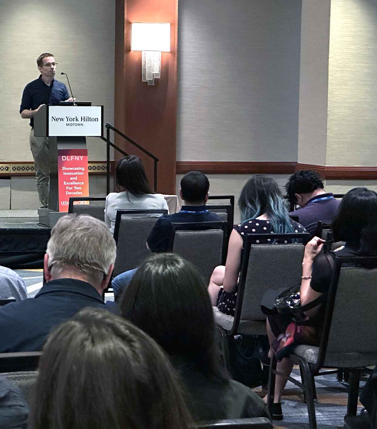 Tal Lazar speaking at a workshop
